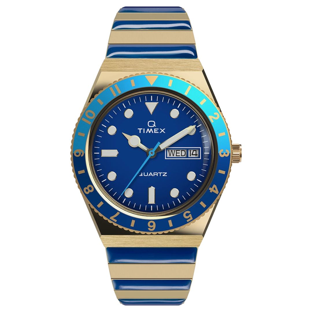 Zegarek damski Timex z granatową tarczą z jasnymi indeksami i wskazówkami oraz niebieskim bezelem w złotej kopercie