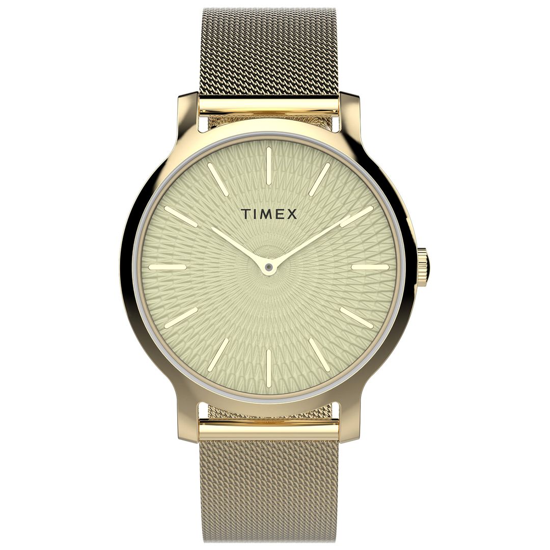 Damski zegarek Timex z geometrycznym wzorem tarczy odbijającym światło oraz złotymi indeksami i wskazówkami
